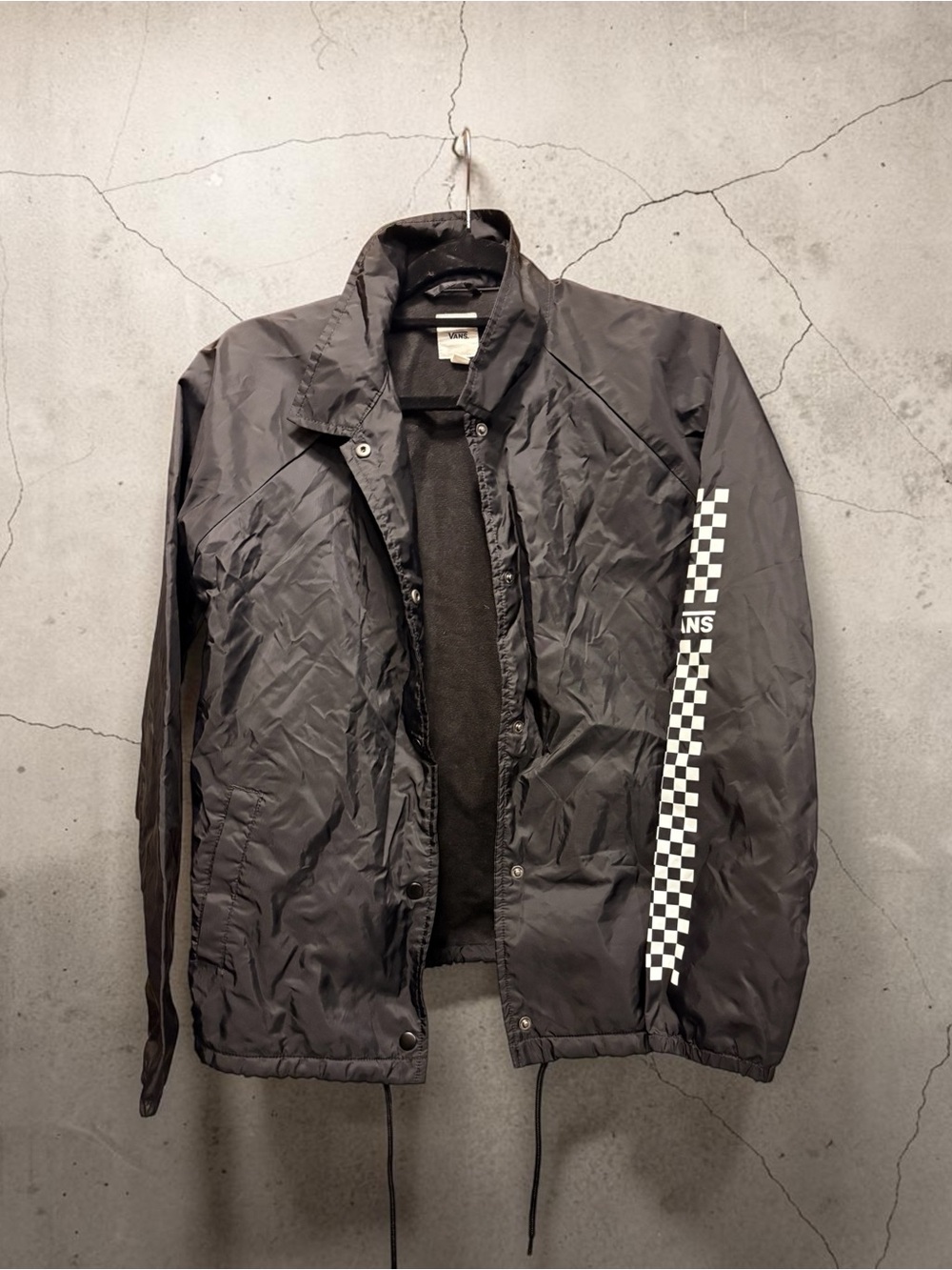 Vans Black Windbreaker with White Checkerboard Sleeve Stripe
